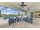 Outdoor living space with a pool, seating, and a screened lanai for relaxed entertaining at 18135 Home Run Dr, Venice, FL 34293