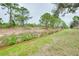 Close up view of the backyard drainage canal, a feature designed to support the property's landscape and irrigation at 1893 Amato St, North Port, FL 34291