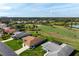 A residence on a lush golf course offering serene pond views and a vibrant community at 1915 Pebble Beach Ct, Venice, FL 34293