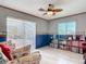 Inviting living room featuring sliding glass doors and beautiful light colored flooring at 2 Windsor Dr, Englewood, FL 34223