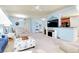 Open-concept living area with comfortable seating and view to the kitchen and dining area at 20181 Ragazza Cir # 101, Venice, FL 34293
