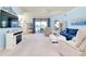 Bright living room with modern decor, features a comfortable seating area, and a sliding door to outside at 20181 Ragazza Cir # 101, Venice, FL 34293