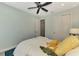 Inviting bedroom featuring bed with plush pillows, closet, and light color palette at 20420 Symphony Pl, Venice, FL 34293