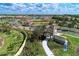 Community entrance with stone architecture, lush landscaping, and clear signage for Renaissance at 20420 Symphony Pl, Venice, FL 34293
