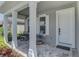 Inviting front porch with brick pavers and rocking chairs at 20420 Symphony Pl, Venice, FL 34293