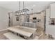 Bright, eat-in kitchen featuring an island with seating, modern appliances, and pendant lighting at 20420 Symphony Pl, Venice, FL 34293