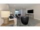 Bright living room showcasing the neutral color palette and view to the lanai and backyard at 20420 Symphony Pl, Venice, FL 34293