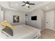 A well-lit main bedroom shows a calm atmosphere with an ensuite bathroom and a ceiling fan at 20420 Symphony Pl, Venice, FL 34293