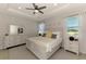 Well-lit main bedroom offers a calm atmosphere with nice ceiling work, a closet, and ensuite at 20420 Symphony Pl, Venice, FL 34293