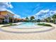 Community pool features a beach-style zero entry area perfect for relaxation at 20420 Symphony Pl, Venice, FL 34293