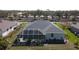 Aerial shot showcasing the home's pool, screened enclosure, and manicured backyard at 2115 Pan American Blvd, North Port, FL 34287