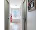 Bright bathroom features a soaking tub under a window with tile floors and neutral decor at 2115 Pan American Blvd, North Port, FL 34287