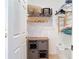 Organized closet featuring wire shelves, wooden hangers, a storage cube, and a laundry basket at 2115 Pan American Blvd, North Port, FL 34287