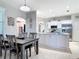 Inviting dining area adjacent to the kitchen, featuring a wooden dining table set for Gathering meals at 2115 Pan American Blvd, North Port, FL 34287