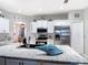 Modern kitchen showcases granite countertops, stainless steel appliances, a central island, and bright white cabinetry at 2115 Pan American Blvd, North Port, FL 34287