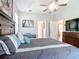 Spacious primary bedroom features a tray ceiling, hardwood floors, and two open entryways at 2115 Pan American Blvd, North Port, FL 34287
