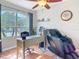 Bright office space with a large window, wooden desk, and comfortable massage chair at 2115 Pan American Blvd, North Port, FL 34287