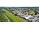 Beautiful aerial view of a residential neighborhood with well-maintained homes and green spaces at 213 Venice Palms Blvd, Venice, FL 34292