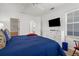 Bedroom showcases ceiling fan, and access to both the bathroom and a walk-in closet at 213 Venice Palms Blvd, Venice, FL 34292
