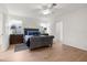 Bright bedroom with wood floors, gray upholstered bed, and decorative blue accents at 213 Venice Palms Blvd, Venice, FL 34292