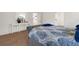 Bedroom features modern furniture, hard surface floors, and an ensuite bath at 213 Venice Palms Blvd, Venice, FL 34292