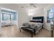 Comfortable bedroom features a ceiling fan, tile flooring, and access to a separate office space at 213 Venice Palms Blvd, Venice, FL 34292