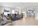 Inviting living room with tile flooring, plush seating, and views into the adjacent dining room at 213 Venice Palms Blvd, Venice, FL 34292