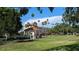 Picturesque park scene featuring a gazebo, palm trees, and a view of the surrounding cityscape at 213 Venice Palms Blvd, Venice, FL 34292