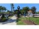 Charming town center with clock tower, lush landscaping, and a visitor kiosk at 213 Venice Palms Blvd, Venice, FL 34292