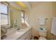 The bathroom features a well lit vanity and built-in wall mirror at 2221 Bal Harbour Dr, Venice, FL 34293