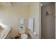 This bathroom features wallpaper, toilet, sink, vanity, and shower at 2221 Bal Harbour Dr, Venice, FL 34293