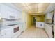 Functional kitchen with white appliances, ample counter space, and easy-to-clean tile flooring at 2221 Bal Harbour Dr, Venice, FL 34293