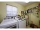 This laundry room features a large window with natural light at 2221 Bal Harbour Dr, Venice, FL 34293