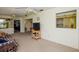 Spacious living room with neutral carpet, a comfortable sofa, and an inviting atmosphere at 2221 Bal Harbour Dr, Venice, FL 34293