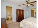 Cozy main bedroom featuring a ceiling fan, closet and ensuite bathroom at 2221 Bal Harbour Dr, Venice, FL 34293