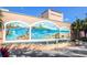 Venice Theatre exterior with a beautiful fountain and a mural depicting a coastal paradise at 2221 Bal Harbour Dr, Venice, FL 34293