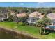 Aerial view of backyard, pool, and scenic waterfront of surrounding community at 23138 Copperleaf Dr, Venice, FL 34293