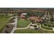 Stunning aerial view showcasing the community, golf course, and scenic surroundings at 23138 Copperleaf Dr, Venice, FL 34293