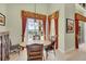 Bright breakfast nook with tile floor, table with seating, and views of the pool and waterway at 23138 Copperleaf Dr, Venice, FL 34293