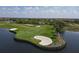 Scenic golf course view featuring lush greenery, a tranquil lake, and manicured landscape at 23138 Copperleaf Dr, Venice, FL 34293