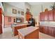Open kitchen with center island and views of the living area, perfect for entertaining at 23138 Copperleaf Dr, Venice, FL 34293