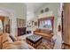 Spacious living room featuring a cozy fireplace, high ceilings, and access to a back yard view at 23138 Copperleaf Dr, Venice, FL 34293