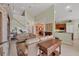 Comfortable living area with open layout, fireplace, and views into the kitchen at 23138 Copperleaf Dr, Venice, FL 34293