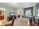 Office space featuring a window seat, desk, views of ensuite bath and bedroom at 23138 Copperleaf Dr, Venice, FL 34293