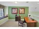 Comfortable office space with a window seat, a dark wood desk and carpet floors at 23138 Copperleaf Dr, Venice, FL 34293