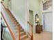 Bright entryway with a carpeted staircase leading up to the second floor at 23138 Copperleaf Dr, Venice, FL 34293
