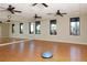 Bright yoga studio with wood floors, mirrored wall, and a serene ambiance at 23138 Copperleaf Dr, Venice, FL 34293
