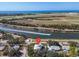 Waterfront home near the ocean featuring lush landscaping, boat access, and nearby airport runway at 2371 Scenic Dr, Venice, FL 34293