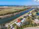 Charming waterfront home featuring backyard access to the canal and partial fencing, providing privacy at 2371 Scenic Dr, Venice, FL 34293