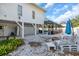 Cozy backyard with stone ground, patio seating and a screened-in pool at 2371 Scenic Dr, Venice, FL 34293